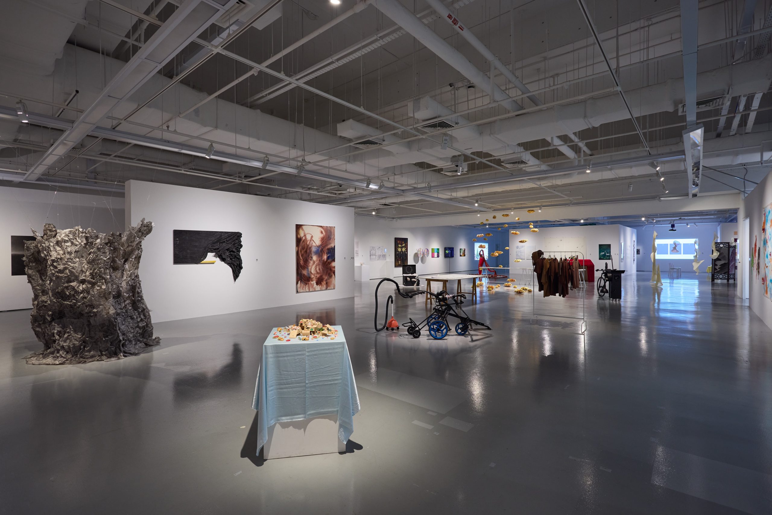 LASALLE exhibition hall with sculptures, mixed media and paintings displayed across wide open space under bright gallery lighting.