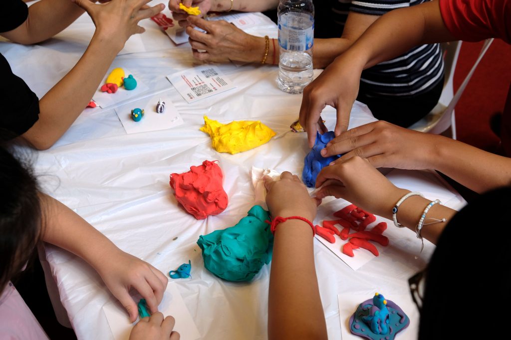 A close-up of the clay sculpting activity.