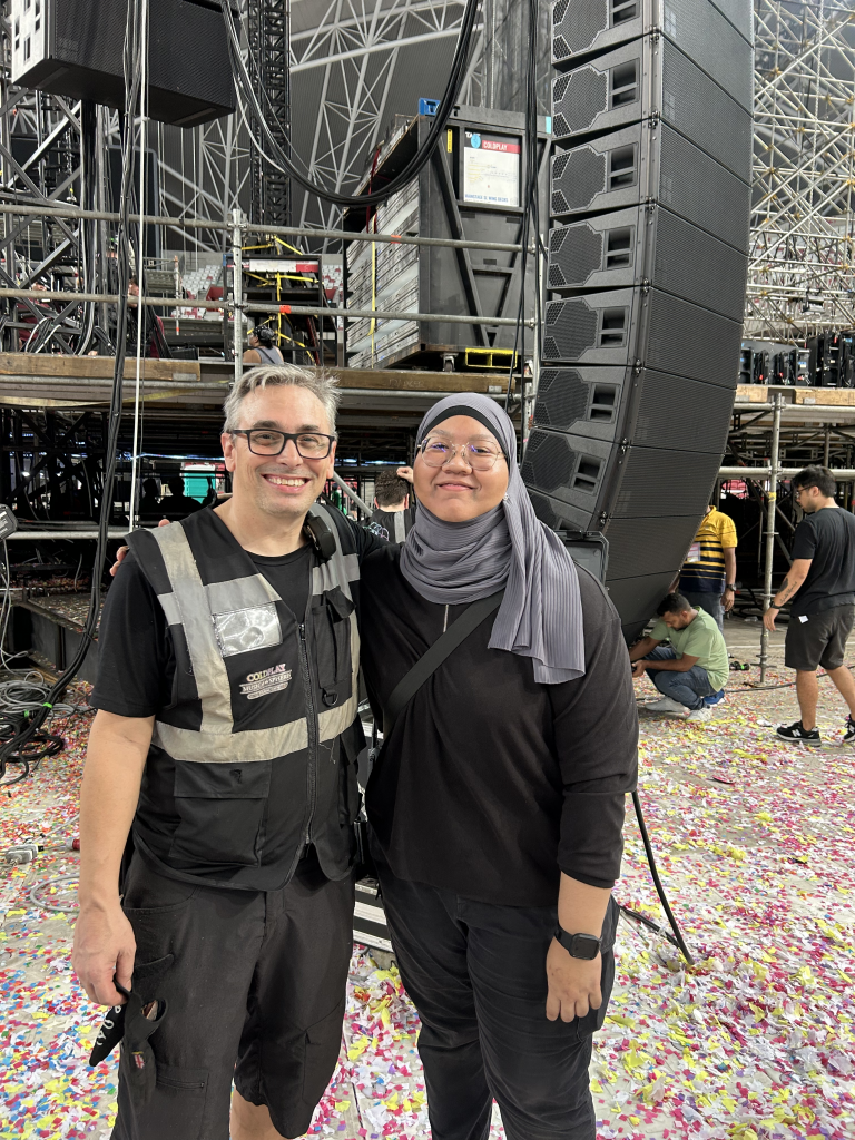 Hidayah with Alex from the Coldplay tour audio team.